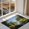 a picture of a landscape is shown on the floor next to a window